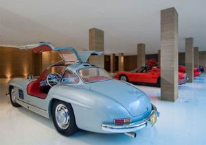 luxury house design ideas - custom garages - Car-garage-in-the-Glass-Pavilion-Montecito-.JPG